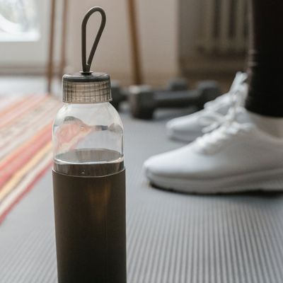 Close-up of a yoga mat and a water bottle.